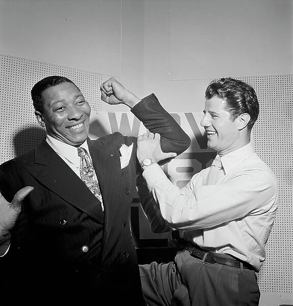 Portrait of Sid Catlett and Freddie Robbins, WOV office, New York, N.Y. ca. June 1947. Creator: William Paul Gottlieb