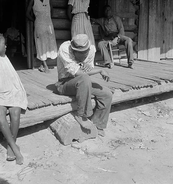 The sharecropper harvest is over in tobacco, near Tifton, Georgia, 1938. Creator: Dorothea Lange