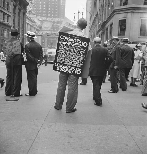 Street hawker selling Consumer s... 42nd Street and Madison Avenue, New York City, 1939. Creator: Dorothea Lange