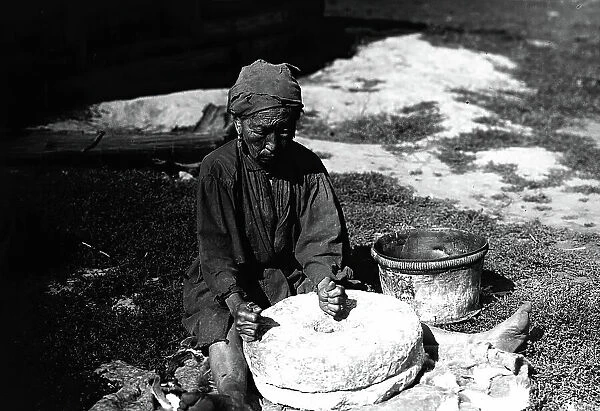 Working with a flour millstone, 1890. Creator: Unknown