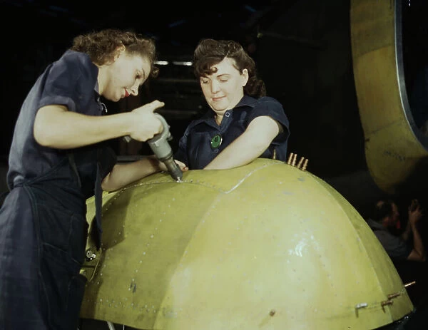 Working on a 'Vengeance'dive bomber, Vultee [Aircraft Inc. ], Nashville, Tennessee, 1943. Creator: Alfred T Palmer