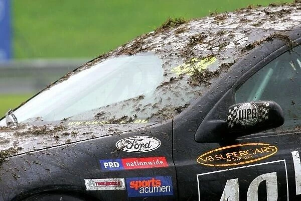 04av810. John McIntyre (NZL) WPS Ford with a mud covered windscreen.