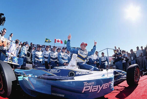 2003 ChampCar St Petersburg Priority. 21-23 February, St Petersburg, Florida, USA. Paul Tracy and the Player's Forsythe Crew in Victory Circle. Copyright: Mike Levitt / USA. LAT Photographic. Ref: 60Mb File