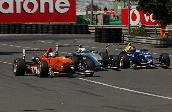 3 wide, going on the start-finish straight. From left to right: Nico Rosberg (FIN)
