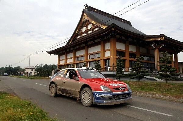 FIA World Rally Championship: Sebastien Loeb, Citroen Xsara WRC, passes a temple