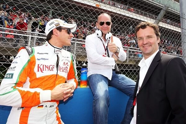 Formula One World Championship: Adrian Sutil Force India F1 with his manager Manfred Zimmerman and Christian Eigen CEO Medion on the grid