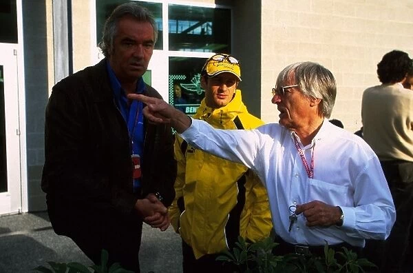 Formula One World Championship: L-R: Flavio Briatore, Jarno Trulli, Bernie Ecclestone