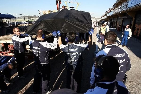 Formula One World Championship: Williams FW32 of Rubens Barrichello Williams is recovered to the pits after breaking down on track