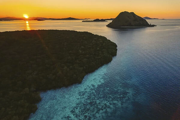 Aerial view of silhouetted islands, Komodo National Park at sunset, Lesser Sunda Islands, Indonesia