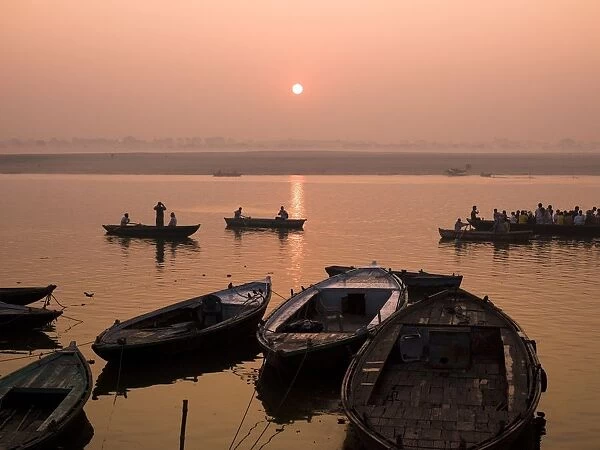 Boats On Ganges River At Sunset; Varanasi, India