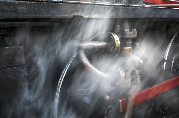 Dust Blurs The Wheels Of A Railroad Car; North Yorkshire, England