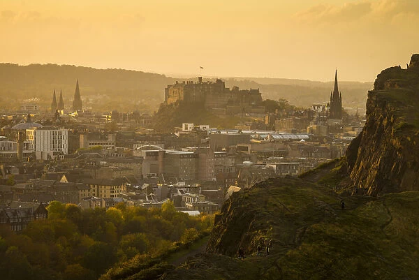 Looking across from Arthurs Seat to Edinburgh Castle and city at dusk; Edinburgh, Scotland, United Kingdom