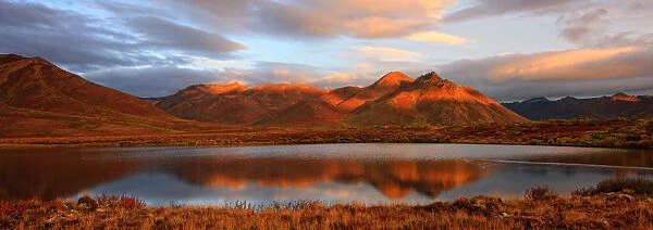 Panoramic Of Sunrise Over Mount Adney Reflected In A Pond In Fall, Along The Dempster Highway, Yukon