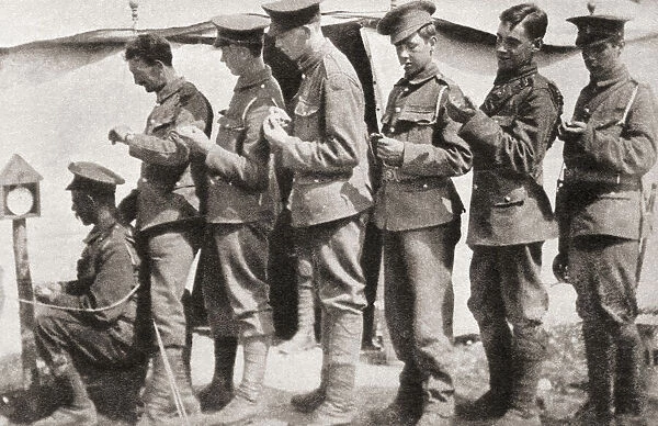 Soldiers during World War One sychronising their watches with a clock mounted on a post in the camp. This was vital to obtain unanimity of movement and perfect co-operation before an attack. From The Pageant of the Century, published 1934