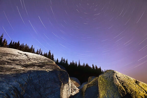 Star Trails Over Rocks In Saguenay-St. Lawrence Marine Park; Ile-Aux-Lievres Quebec Canada