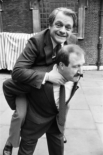 Actor David Jason (Only Fools and Horses) on the back of Gordon Kaye ( Allo