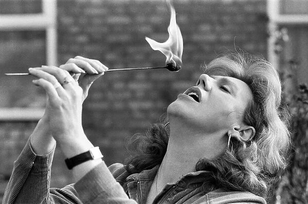 Actress Anna Karen practising her fire-eating act at her home in Ilford, Essex