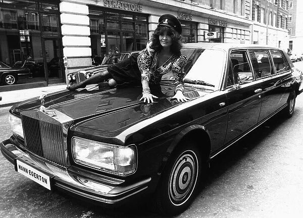 Actress Kate O'Mara on the bonnet of a Rolls Royce October 1987 Of Dynasty