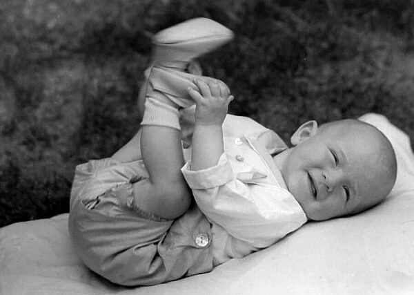 Baby lying outside in the garden. c. 1945 P044490