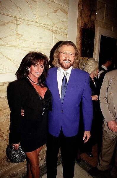 Barry gibb one of the three Bee Gees with wife at the opening night of
