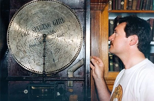 Beamish Museum keeper of socila history Lloyd Langley with an 1897 juke box in July 1995