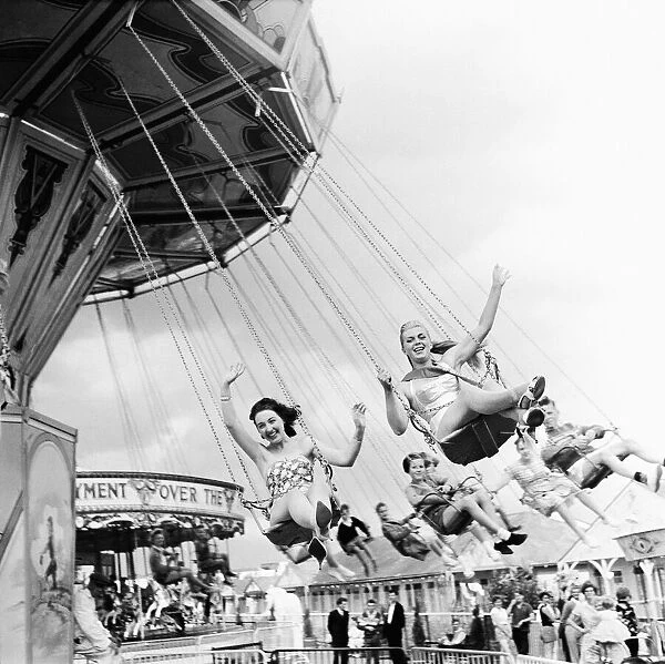 Beauty contest girls at Clacton Butlins on a fairground ride