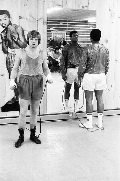 Boxers Muhammad Ali and Bob Foster in the gym. January 1973