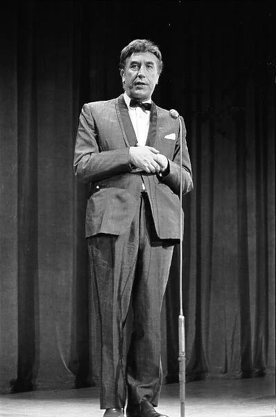 British comedian Frankie Howerd performs on stage during rehearsals for the Royal Variery