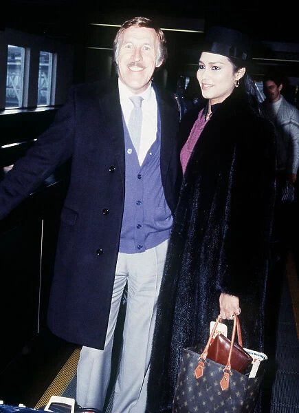 Bruce Forsyth television presenter  /  entertainer at Heathrow with girlfriend Wilnelia