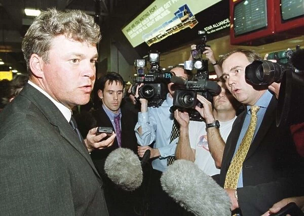 Darren Clarke talks to the press at Heathrow Sept 1999 after the Ryder Cup defeat