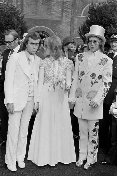 Elton John (right) pictured here as best man to his songwriting partner Bernie Taupin