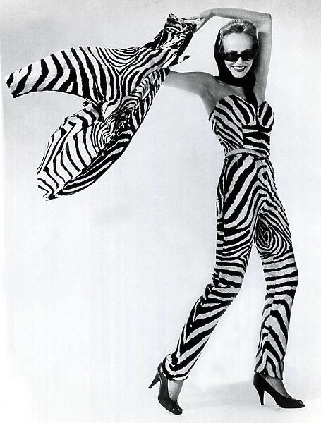 Fashion 1970s Model wearing fake zebra skin trousers with matching bodice and jacket