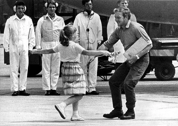 A FATHER IS REUNITED WITH HIS DAUGHTER AFTER RETURNING FROM THE FALKLANDS WAR - 1982