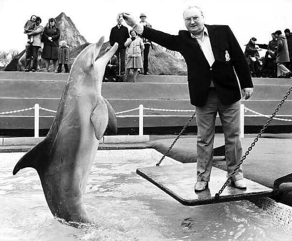 Fred Feast Actor who played Fred Gee in Coronation Street pictured with a Dolphin leaping