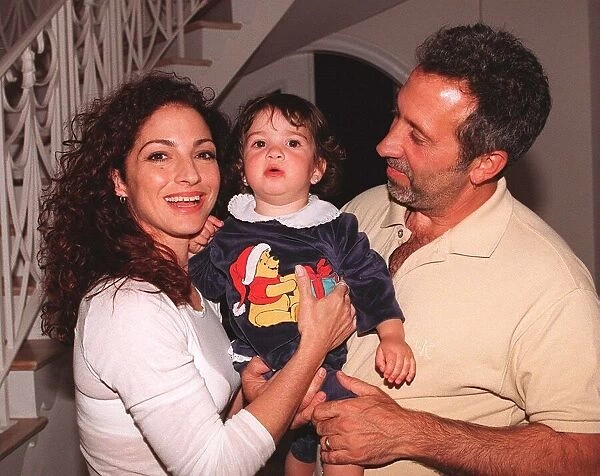 Gloria Estefan with husband Emilio and daughter Emily 14 months at home on Star
