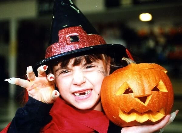 Halloween - little witch Bethan Parker (aged 6) of Rhydyfelin with her Halloween pumpkin