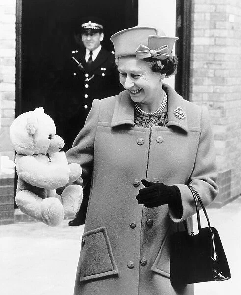 HRH Queen Elizabeth II With teddy bear for Princess Beatrice June 1989