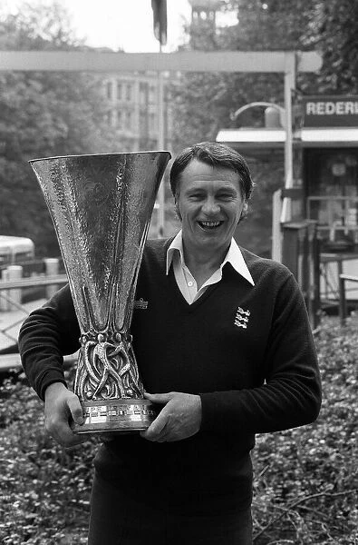 Ipswich Town manager Bobby Robson holds the UEFA Cup trophy after his side defeated AZ 67