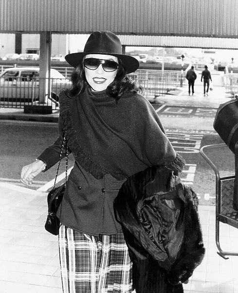 Joan Collins the actress at Heathrow airport in October 1988