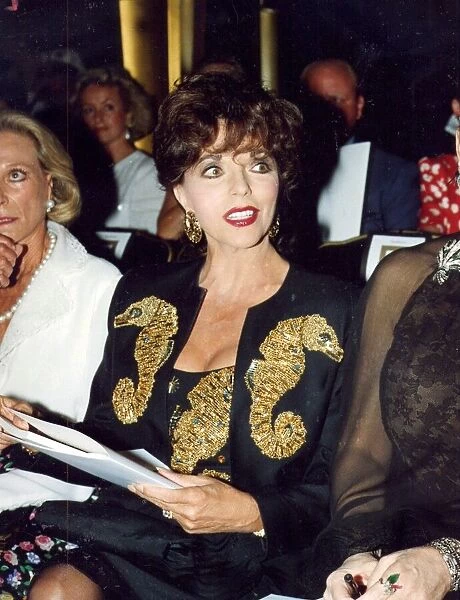Joan Collins at Valentino fashion show wearing jewelled suit - July 1989