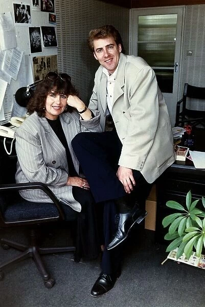 Jonathan Ross TV Presenter sitting on desk with his mother Maureen