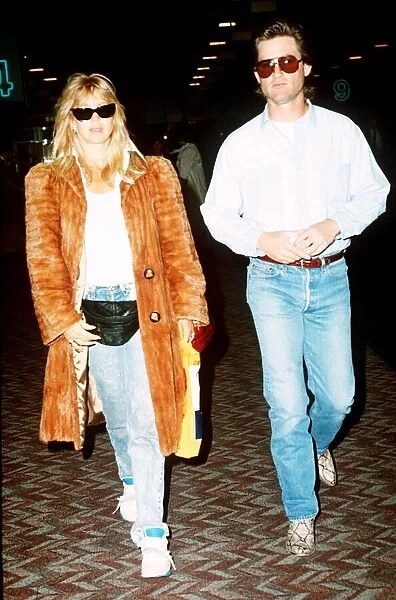 Kurt Russell actor with Goldie Hawn actress at Heathrow Airport DBase MSI