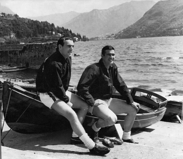 Liverpool footballers Ian St John and Ron Yeats relax on the shores of Lake Como at their