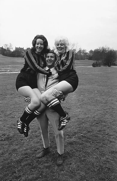 Malcolm Allison seen here with two models modeling Mnchester Citys new strip for the 1969