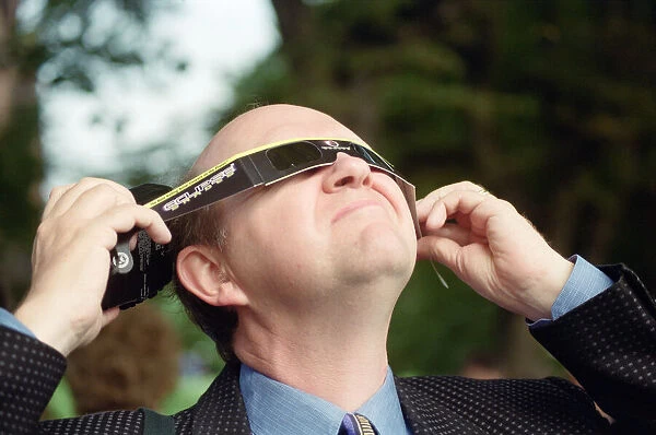 A man watching the solar eclipse in Chester. 11th August 1999