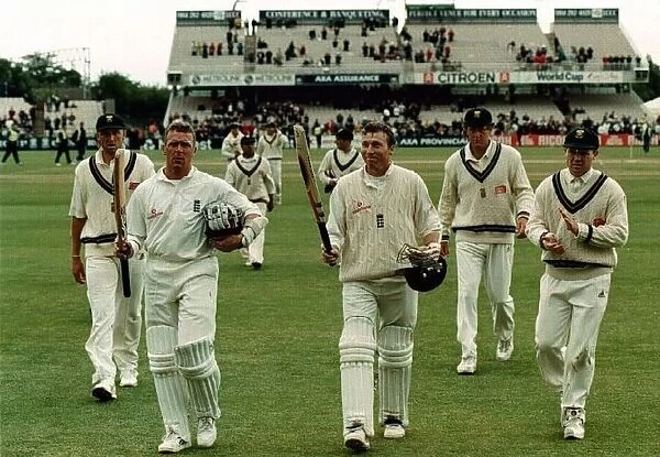 Mike Atherton and Alec Stewart leave the field July 1998 after putting on over two