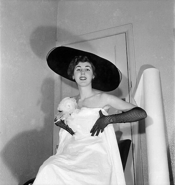 Model Shirley Galley, 'Miss Velvet'seen here having her dress fitted by