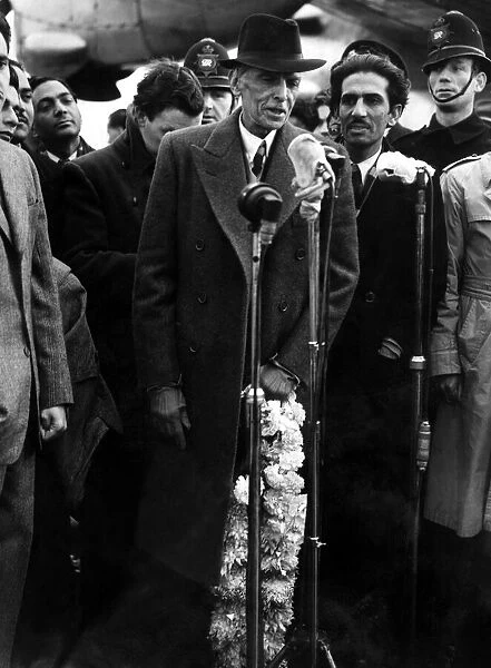 Mohammed Ali Jinnah - President of the Moslim League speaking into the microphone on his
