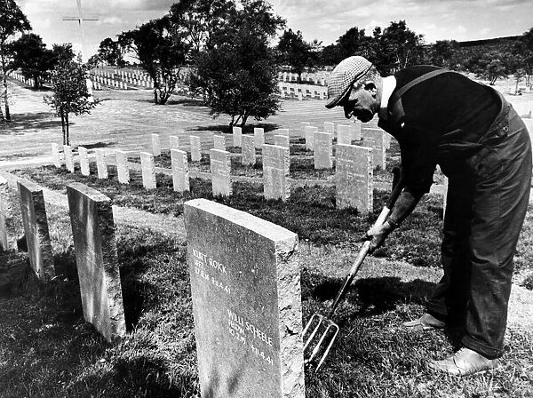 Mr Thomas Fox tidying graves at the German War Cemetery on Cannock Chase