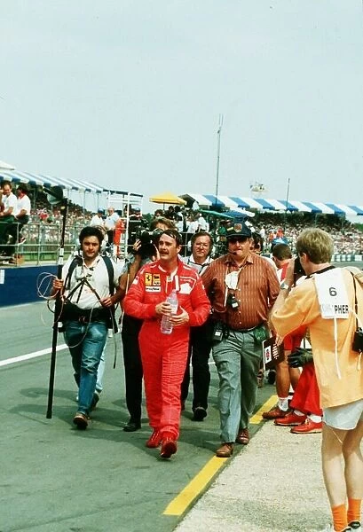 Nigel Mansell Motor Racing Driver Formula One F1 walks from the Silverstone Track after